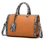 Image of a brown snakeskin leather purse bag