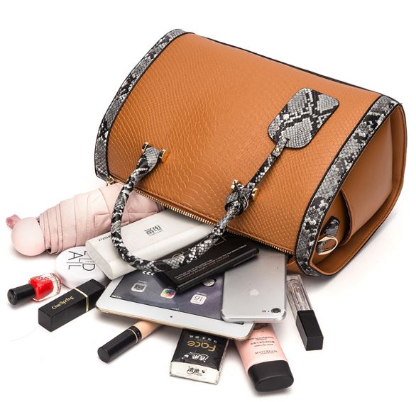 Image of a brown snakeskin leather purse bag with its contents spilling out of the bag