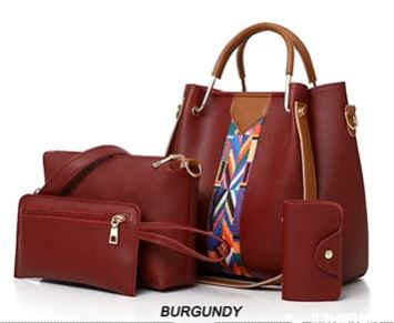 Image of a burgundy four-piece purse set with tribal print trim, including a large tote Bag, a large shoulder bag, a wallet-sized accessory bag, and a cardholder wallet. 