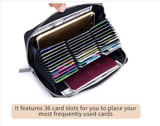  Image of the inside of a women's leather clutch wallet with an anti-theft RFID feature. The inside displays an iPhone, cash, and credit cards