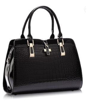 Image of a women's black designer crocodile patent leather handbag.