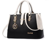 Image of a women's black executive inspired handbag