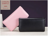 Image of multiple women's leather clutch wallets with anti-theft RFID feature 2 Colors in black, pink