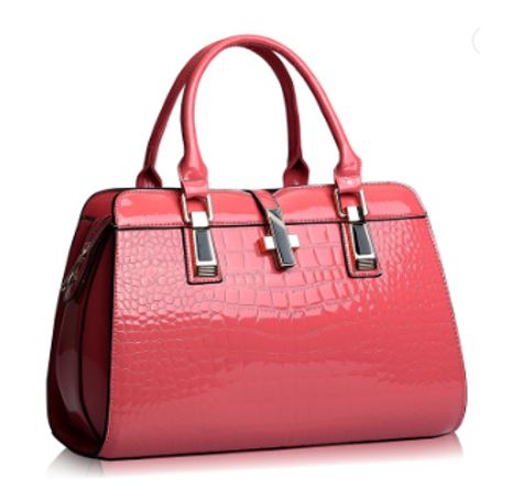 Image of a women's pink designer crocodile patent leather handbag.