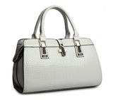 Image of a women's gray designer crocodile patent leather handbag.