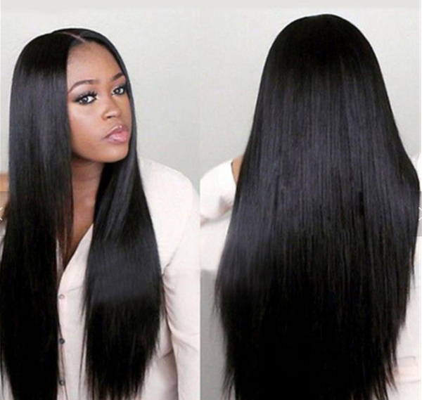 Image of a woman wearing a woman's black long straight naturally parted hair wig.